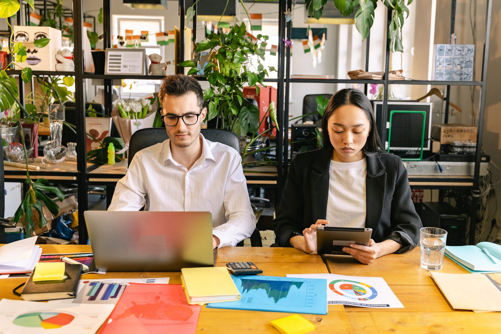 A Man and a Woman Working in the Office A Man and a Woman Working in the Office